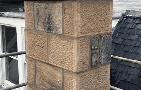 Chime Restored sandstone chimney stack with traditional stone detailing