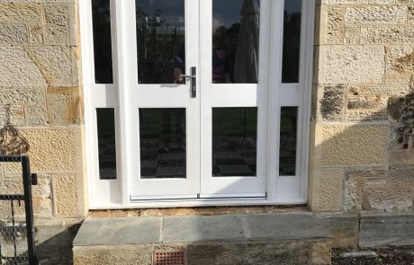 image00040 Repaired stone entrance threshold beneath white doors